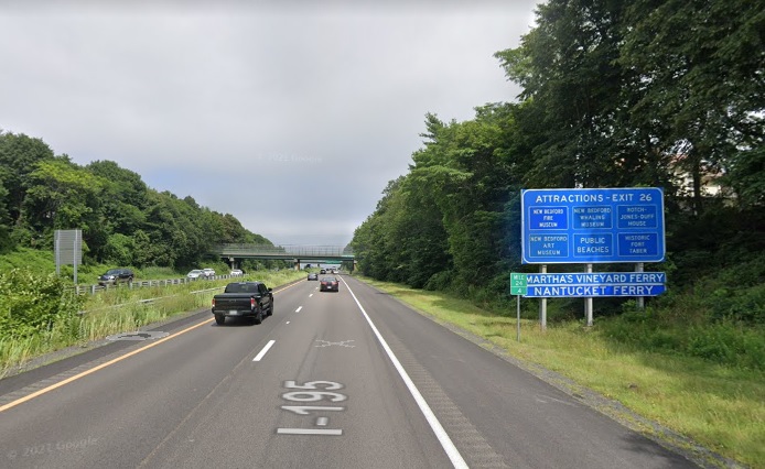 Google Maps Street View image of Blue Attractions Services sign for MA 18 South exit with new milepost based exit number on I-195 East in New Bedford, July 2021