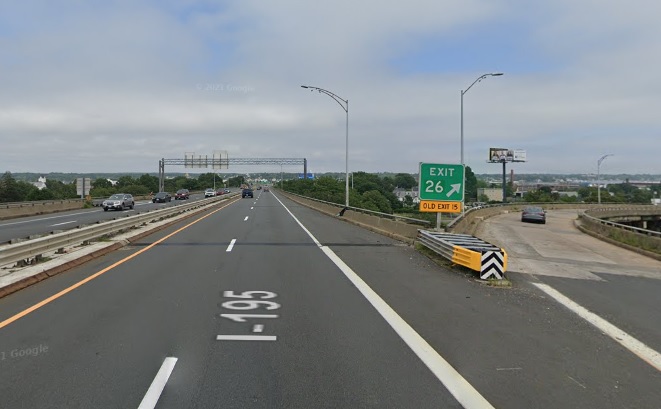 Google Maps Street View image of gore sign for MA 18 South exit with new milepost based exit number and Old Exit 15 sign attached below bridge on I-195 East in New Bedford, July 2021