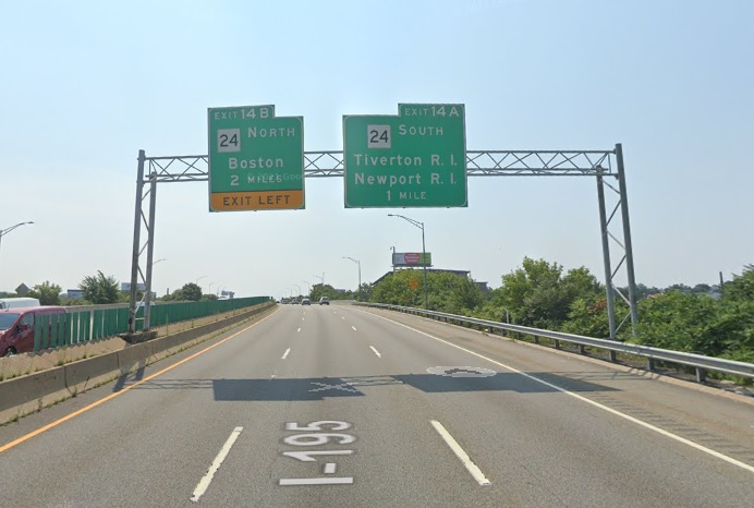 Google Maps Street View image of 2 mile advance sign for MA 24 North and 1 mile advance overhead sign for MA 24 South exit with new milepost based exit number on I-195 East in Fall River, July 2021