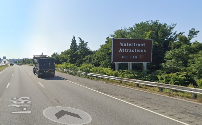 Google Maps Street View image of auxiliary sign for MA 79/138 exit with new milepost based exit number on I-195 East in Fall River, July 2021