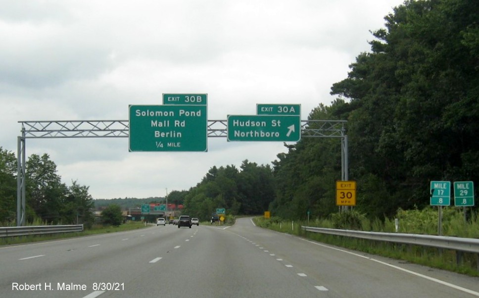 Image of overhead ramp sign for Hudson Street/Solomon Pond Mall Road exit with new milepost based exit number on I-290 East in Boylston, August 2021