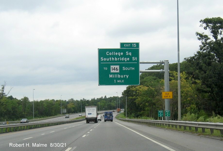 Image of 1 mile advance overhead sign for Southbridge Street exit with new I-395 milepost and yellow Old Exit 11 advisory sign on support on I-290 East in Auburn, August 2021