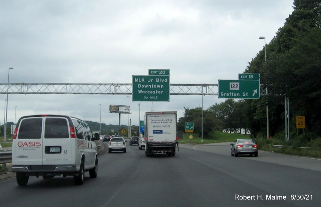 Image of recently placed overhead signage at ramp for MA 122 exit with new I-395 milepost based exit numbers on I-290 East in Worcester, August 2021