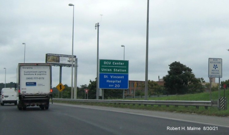 Image of combination green auxiliary and blue hospital sign for MLK Blvd exit with new I-395 milepost based exit number on I-290 East in Worcester, August 2021 