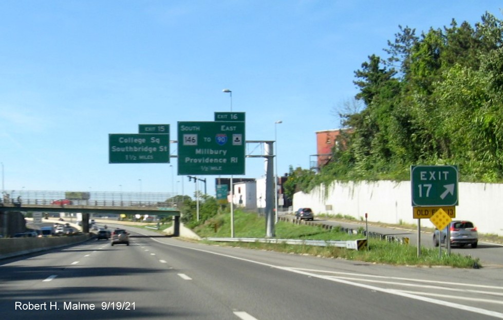Image of gore sign for MA 122A exit with new milepost based exit number and yellow Old Exit 13 sign attached below on I-290 West in Worcester, September 2021