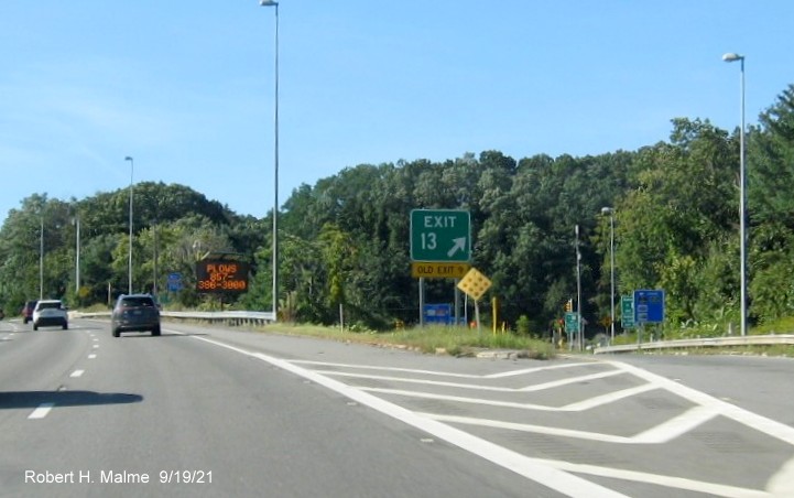 Image of gore sign for Auburn Street exit with new milepost based exit number and yellow Old Exit 9 sign attached below on I-290 West in Auburn, September 2021