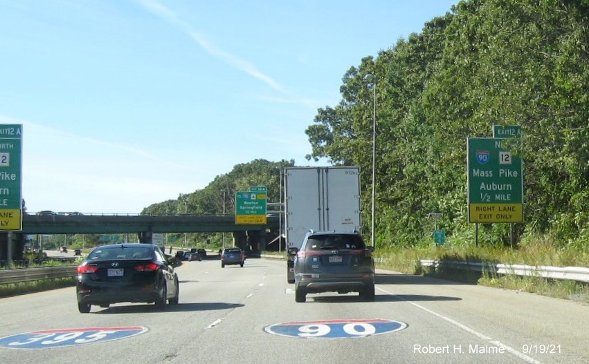 Image of pair of older ground mounted 1/2 mile advance signs for To I-90/Mass Pike exit with new milepost based exit number on I-290 West in Auburn, September 2021