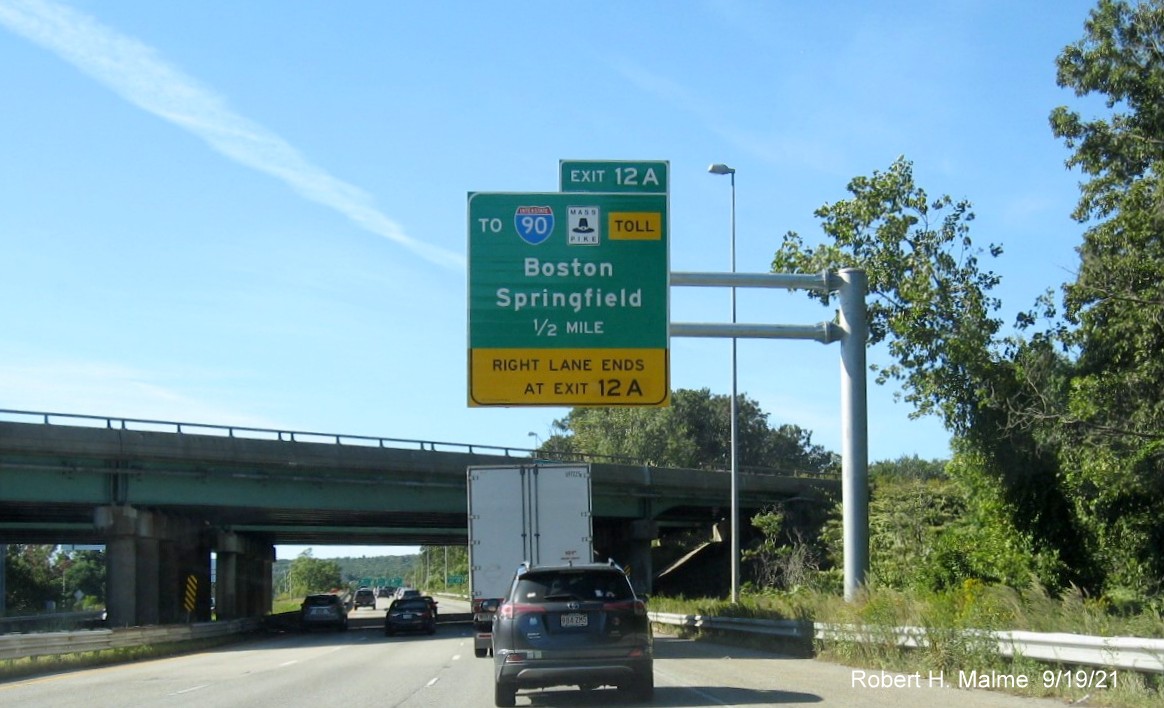 Image of newly placed 1/2 mile advance overhead sign for To I-90/Mass Pike exit with new milepost based exit number on I-290 West in Auburn, September 2021