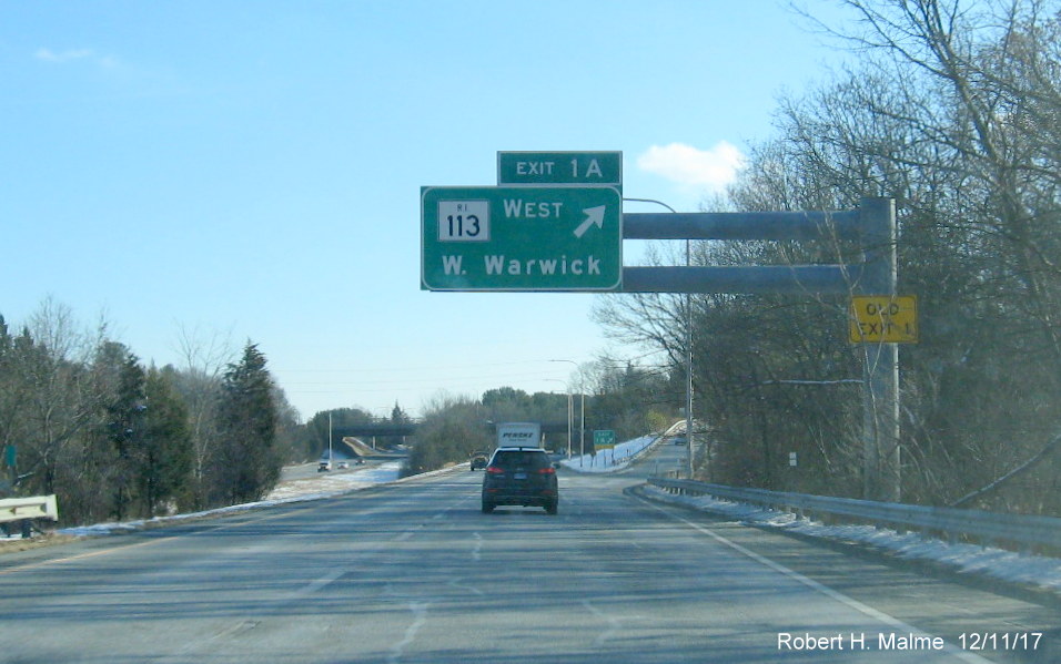 Image of overhead sign for RI 113 West exit on I-295 South in Warwick with new exit number