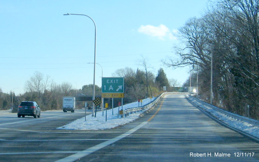 Image of new RI 113 West Exit Gore Sign with new number and yellow old exit number tab on I-295 South in Warwick