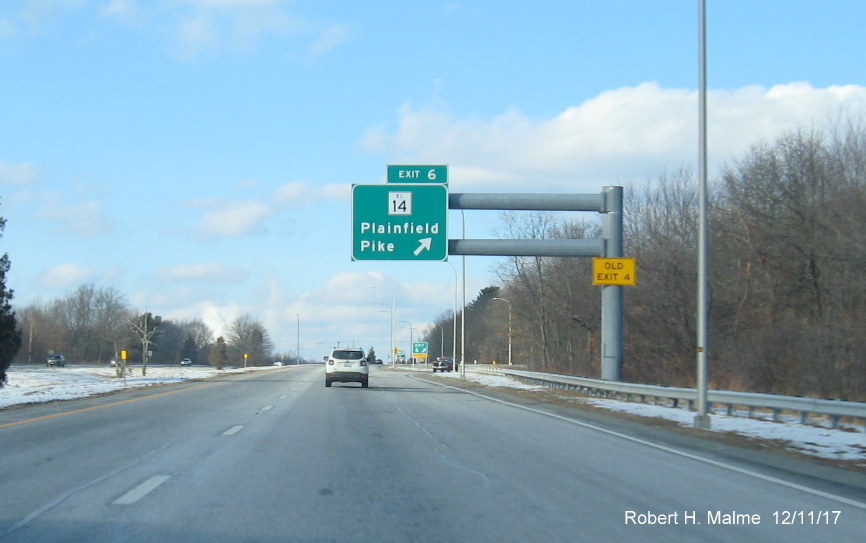 Image of overhead 1/2 mile advance sign for RI 14 exit on I-295 North in Warwick with new exit number