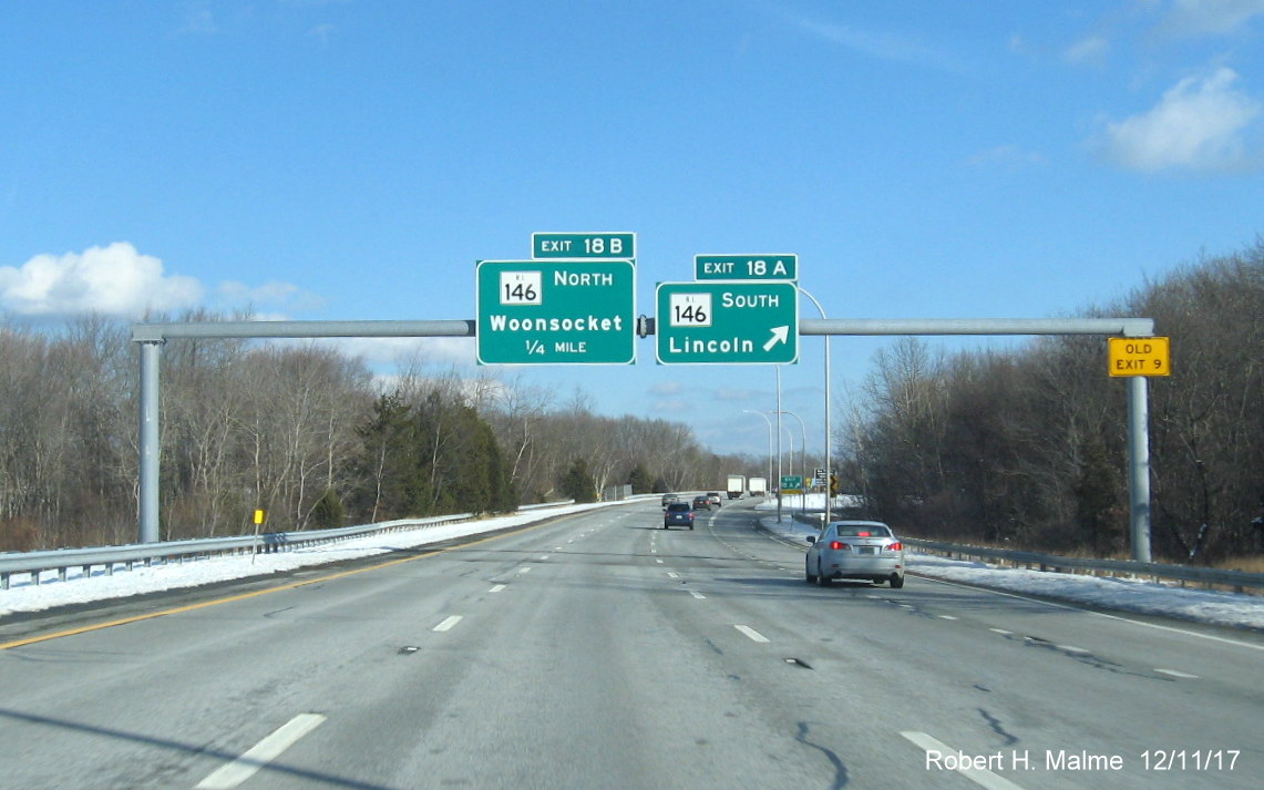 Image of overhead ramp signs for RI 146 exits from I-295 North in Lincoln with new exit numbers