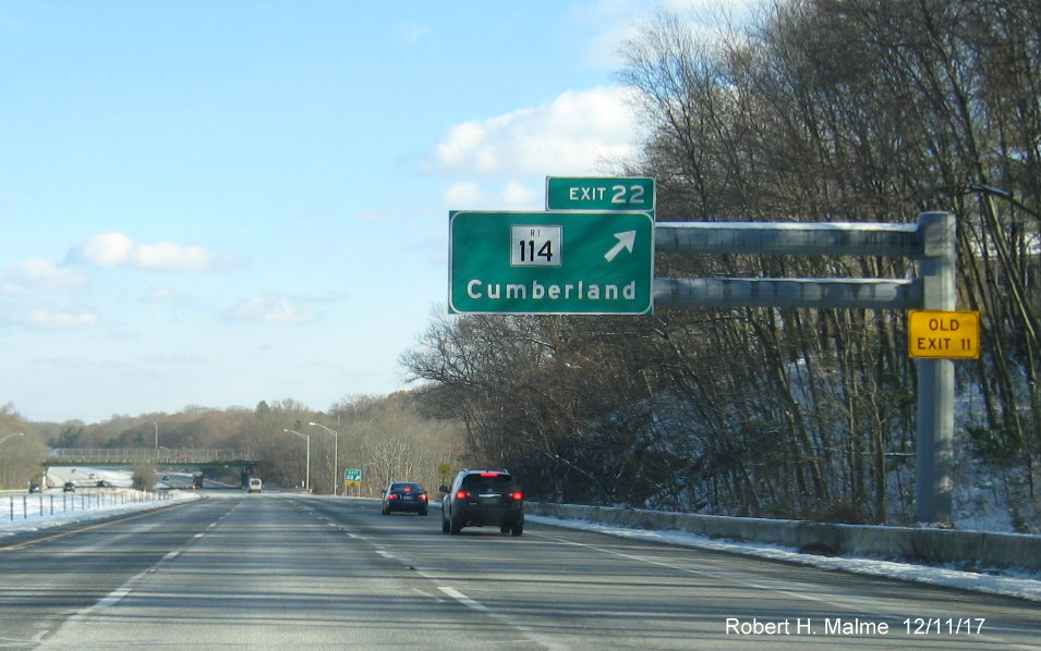 Image of overhead sign for RI 114 exit ramp on I-295 North in Cumberland with new exit number