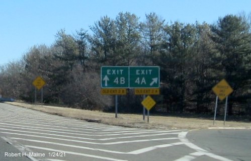 Image of gore signs for I-95 Exits with new milepost based exit numbers and yellow Old Exit number signs below each on I-295 North in Attleboro, January 2021