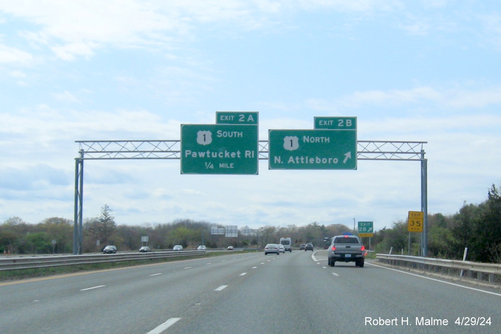 Image of recently placed overhead signage at ramp for US 1 North exit on I-295 South in Attleboro, April 2024