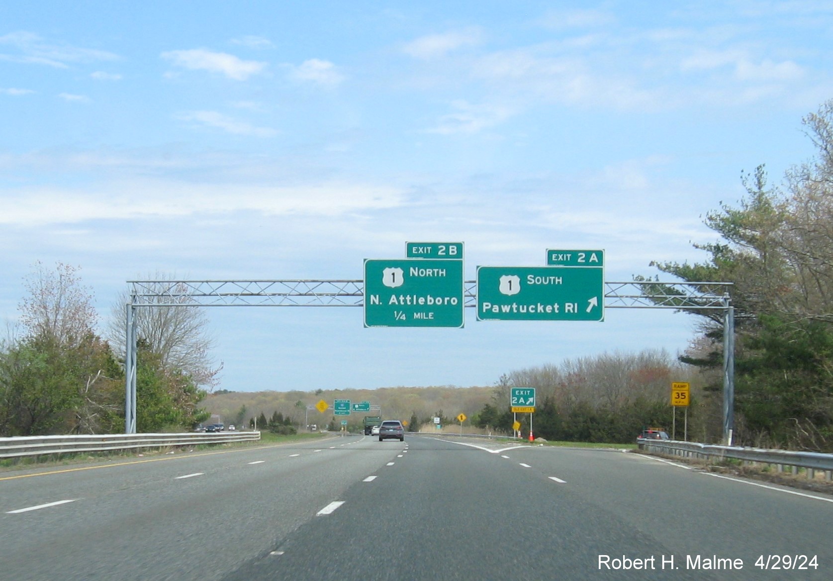 Image of recently placed overhead signs at ramp for US 1 South exit on I-295 North in Attleboro, April 2024