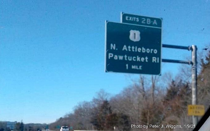 Image of 1-Mile advance overhead signs for US 1 exits with new milepost based exit number and yellow Old Exits 1 A-B sign on support post on I-295 South in Attleboro, by Peter J. Wiggins, January 2021