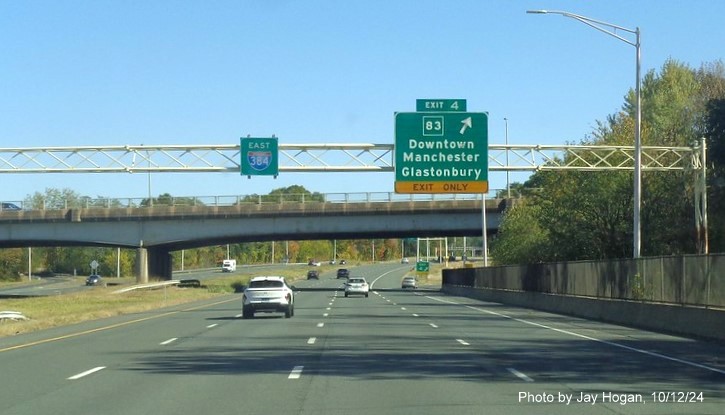 Image of overhead ramp sign for CT 83 exit with new milepost based ext number, by Jay Hogan, October 2024