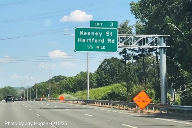 Image of new 1/2 mile advance sign for the Keeney Street/Hartford Street exit 
	with milepost based exit number, no old exit sign, by Jay Hogan, August 2025