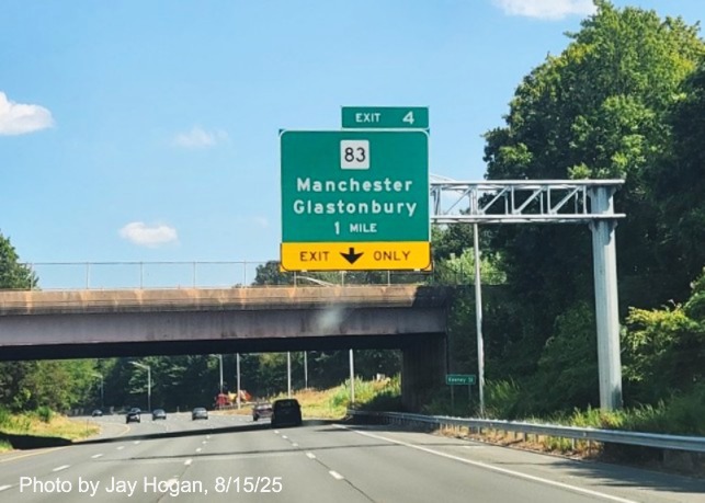 Image of new 1 mile advance sign for the CT 83 exit with milepost 
	based exit number, no Old Exit sign, by Jay Hogan, August 2025