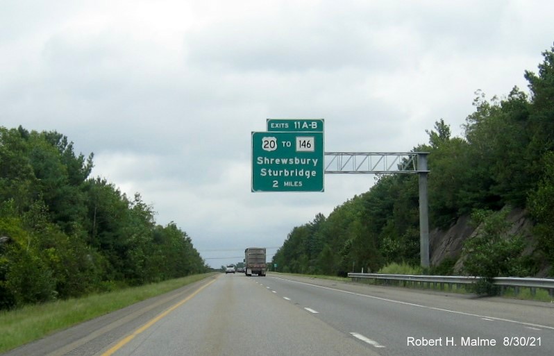 Image of 2 miles advance sign for US 20 to MA 146 exits with new milepost based exit numbers on I-395 North in Oxford, August 2021