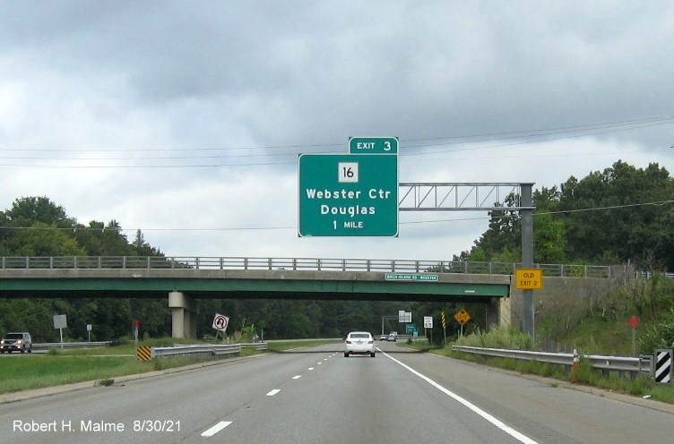 Image of 1 mile advance overhead sign for MA 16 exit with new milepost based exit number and yellow Old Exit 2 advisory sign on support on I-395 North in Webster, August 2021 with 