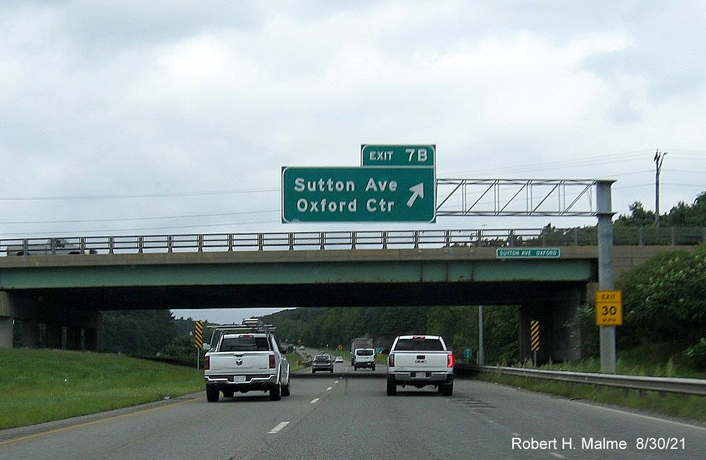 Image of overhead exit sign for Sutton Avenue West exit with new milepost based exit number on I-395 North in Oxford, August 2021 