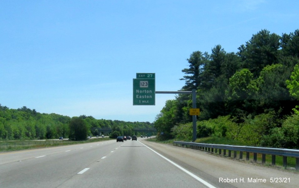 Image of 1 mile advance overhead sign for MA 123 exit with new milepost based exit number and yellow Old Exit 10 advisory sign on support on I-495 South in Norton, May 2021