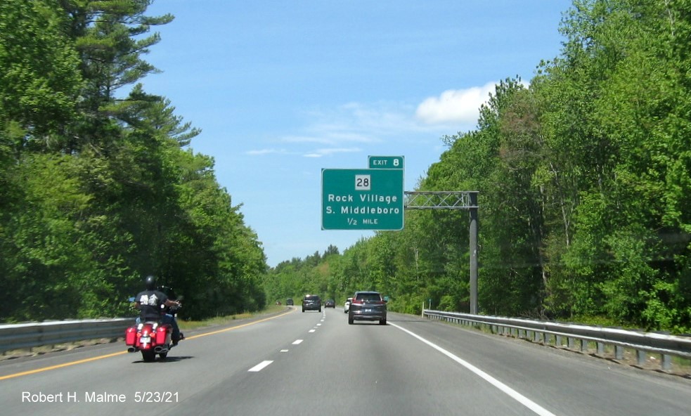 Image of 1/2 mile advance overhead sign for MA 28 exit with new milepost based exit number on I-495 North in Middleboro, May 2021