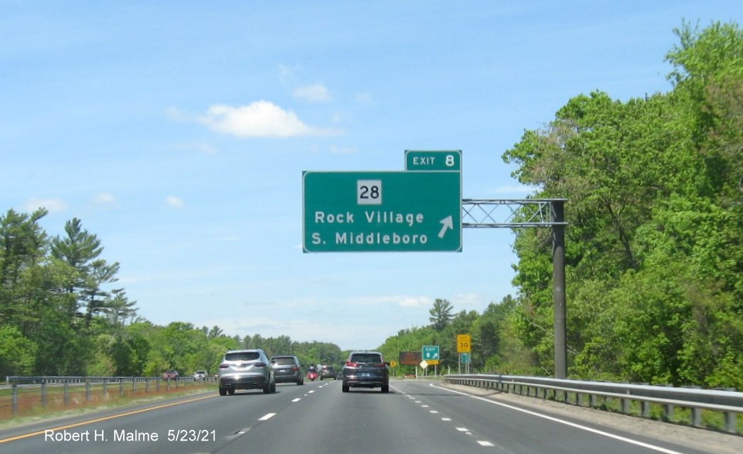 Image of overhead ramp sign for MA 28 exit with new milepost based exit number on I-495 North in Middleboro, May 2021