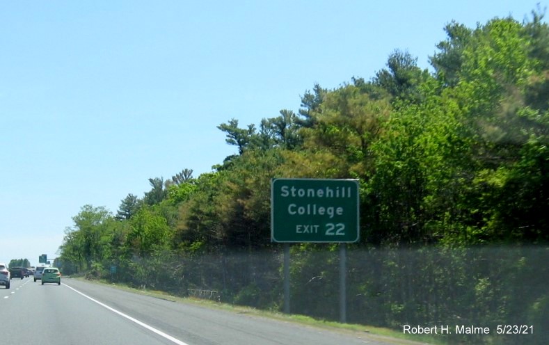 Image of auxiliary sign for MA 138 exit with new milepost based exit number on I-495 South in Taunton, May 2021