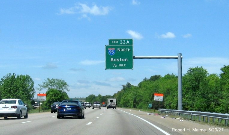 Image of 1/2 Mile advance overhead sign for I-95 North exit with new milepost based exit number on I-495 North in Mansfield, May 2021