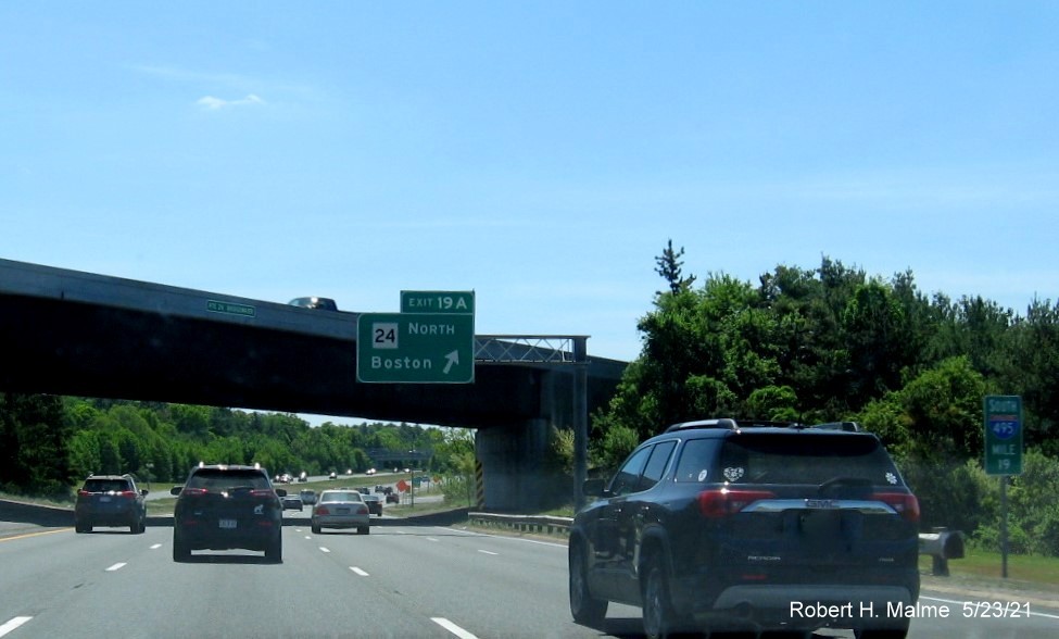 Image of overhead ramp sign for MA 24 North exit with new milepost based exit number on I-495 South in Raynham, May 2021