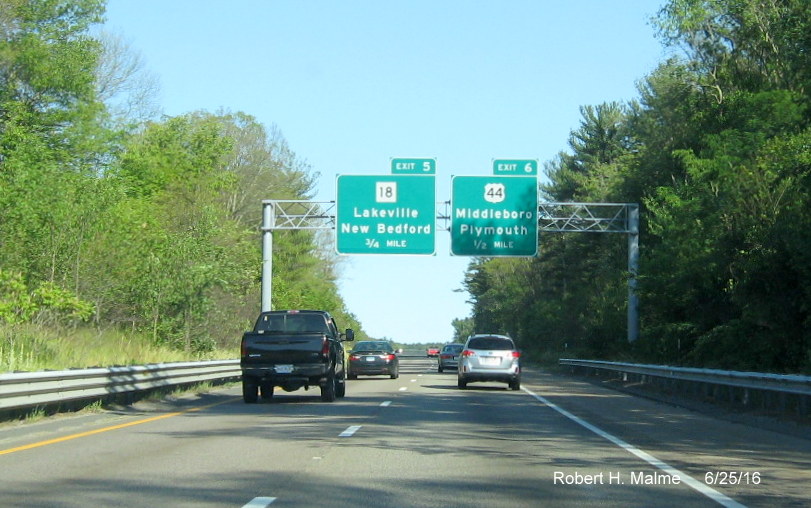 Image of overhead advance signs for MA 18 and US 44 exits on I-495 South in Middleboro in June 2016