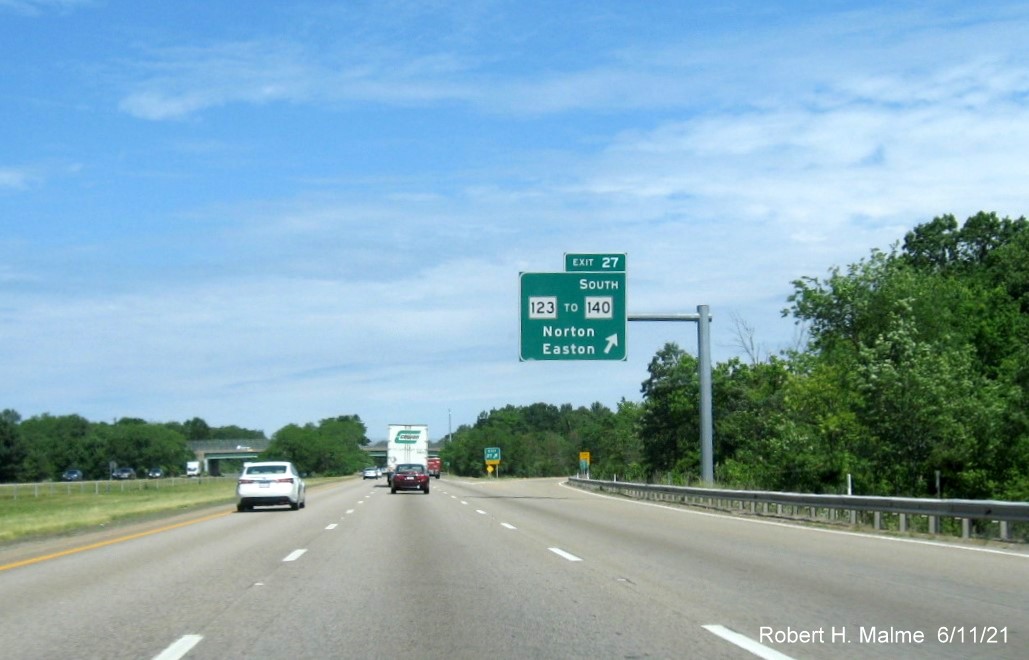 Image of overhead ramp sign for MA 123 to MA 140 North exit with new milepost based exit number on I-495 North in Norton, June 2021