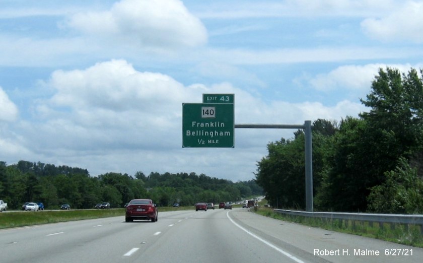 Image of 1/2 mile advance overhead sign for MA 140 exit with new milepost based exit number on I-495 South in Franklin, June 2021