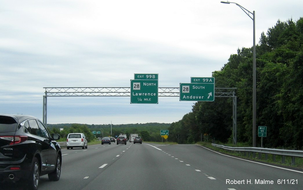 Image of overhead signage at ramp for MA 28 South exit with new milepost based exit number on I-495 North in Andover, June 2021