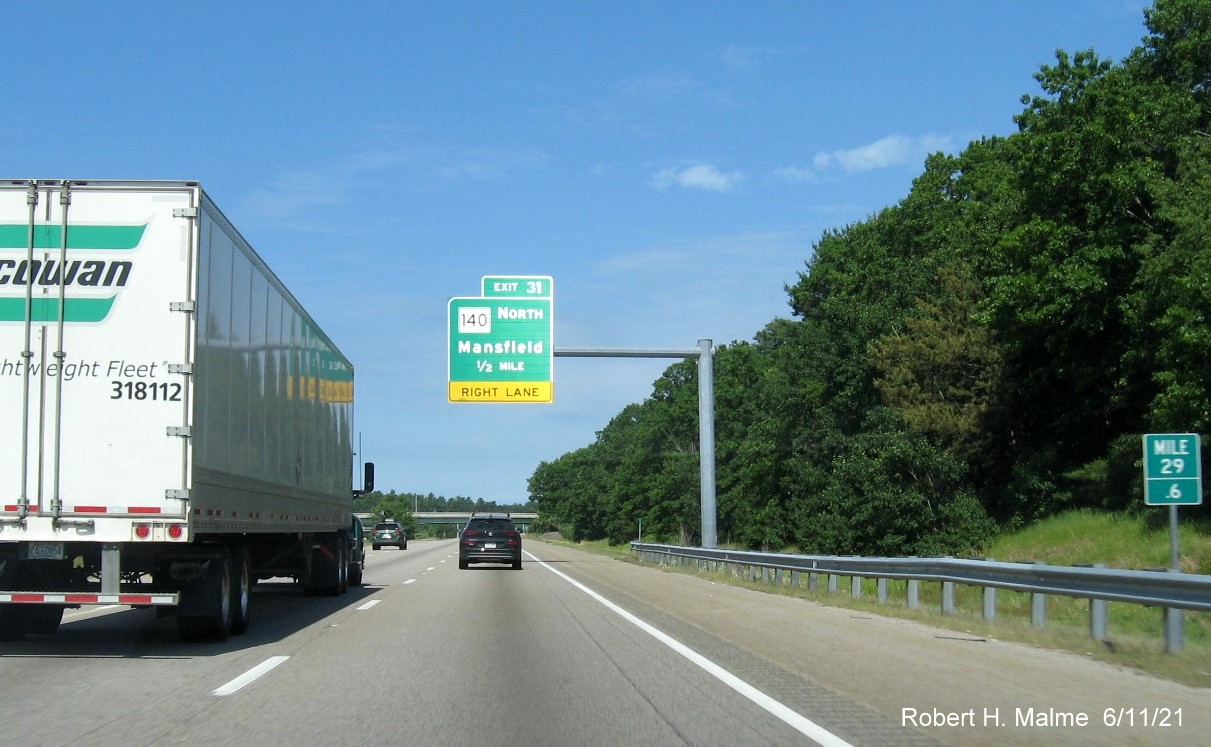 Image of 1/2 mile advance overhead sign for MA 140 North exit with new milepost based exit number on I-495 North in Mansfield, June 2021