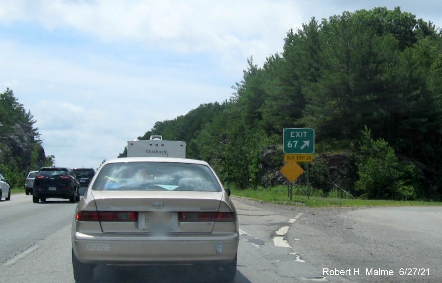 Image of overhead ramp sign for MA 62 exit with new milepost based exit number on I-495 South in Hudson, June 2021