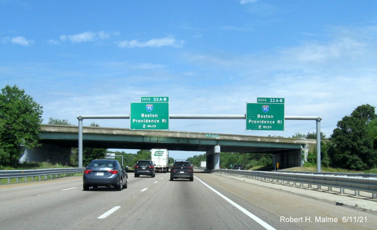Image of 2 miles advance overhead signs for I-95 exit with new milepost based exit numbers on I-495 North and C/D ramp from MA 140 North exit in Mansfield, June 2021
