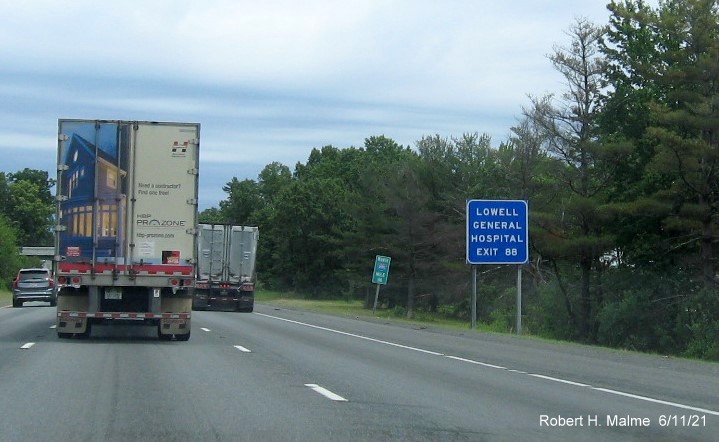 Image of blue Hospital services sign for MA 110 Chelmsford exit with new milepost based exit number on I-495 North, June 2021