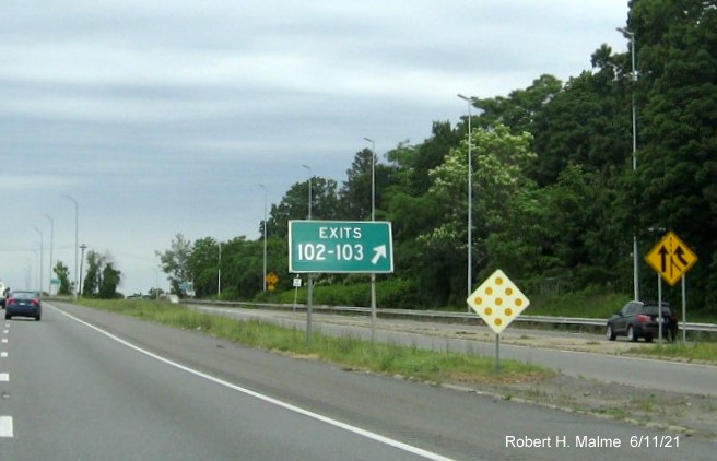 Image of gore sign for Marston Street, Merrimack Street and Commonwealth Drive exits with new milepost based exit numbers and yellow Old Exits 44-45 sign attached below on I-495 North in Lawrence, June 2021