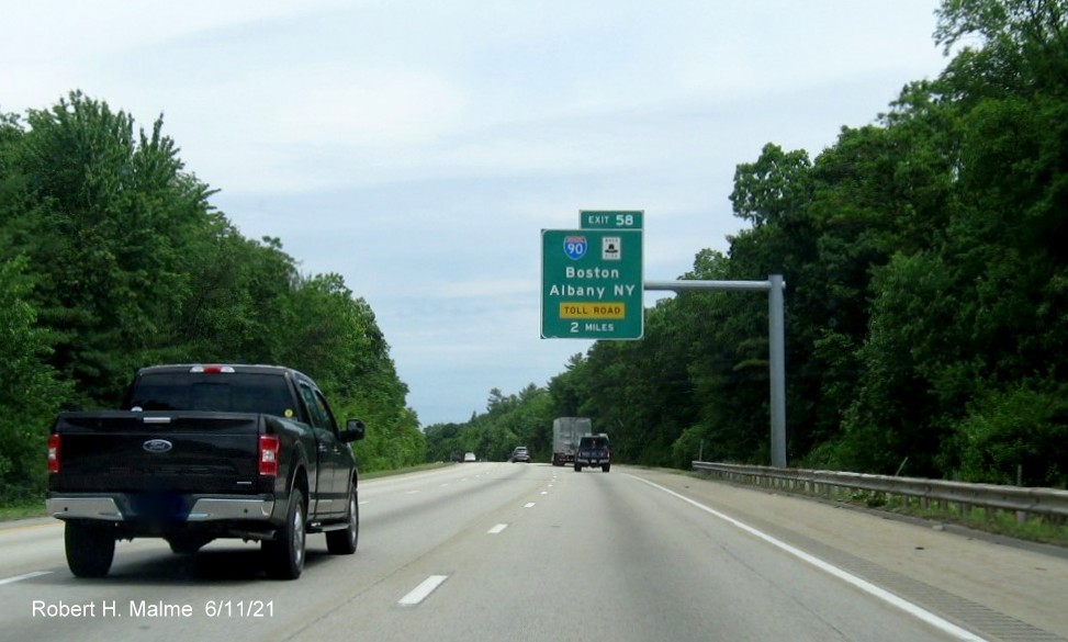 Image of 2 miles advance overhead sign for I-90/Massachusetts Turnpike exit with new milepost based exit number on I-495 North in Hopkinton, June 2021