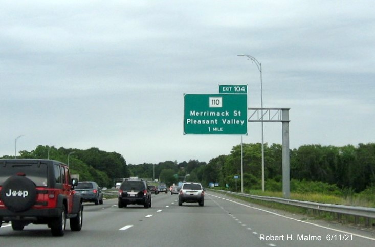 Image of 1 mile advance overhead sign for MA 110 exit with new milepost based exit number on 
                                              I-495 North in Lawrence, June 2021