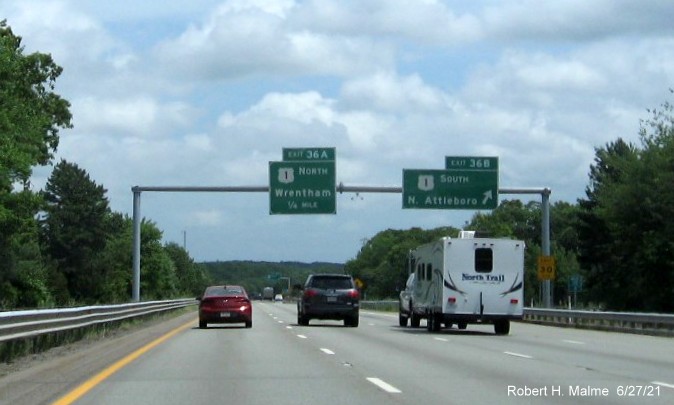 Image of overhead signage at ramp for US 1 South exit with new milepost based exit number on I-495 South in Wrentham, June 2021 
