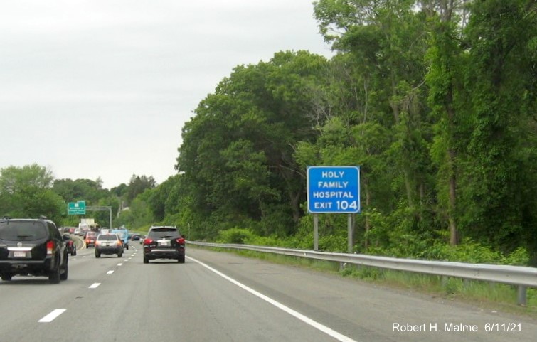 Image of blue auxiliary sign for MA 110 exit with new milepost based exit number on I-495 North in 
                                          Lawrence, June 2021
