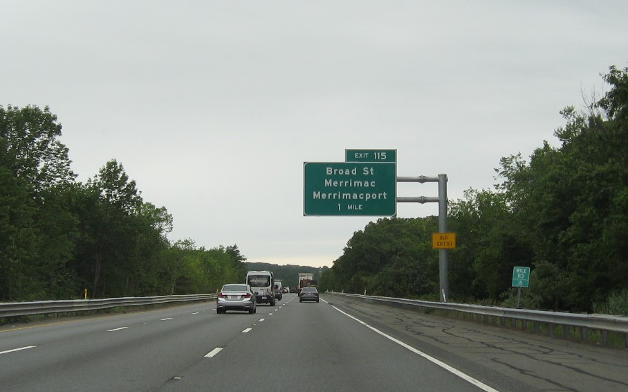 Image of 1 Mile advance overhead sign for Broad Street exit with new milepost based exit number and yellow Old Exit 53 advisory sign on support on I-495 North in Merrimac, June 2021