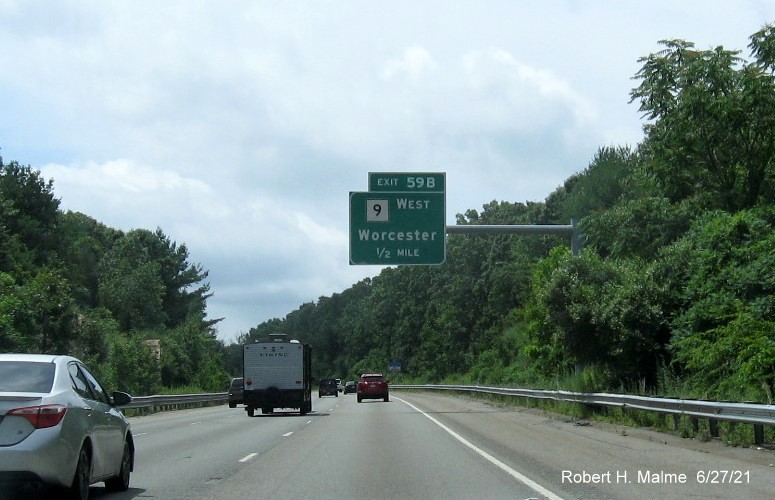 Image of 1/2 mile advance overhead sign for MA 9 West exit with new milepost based exit number on I-495 South in Southborough, June 2021