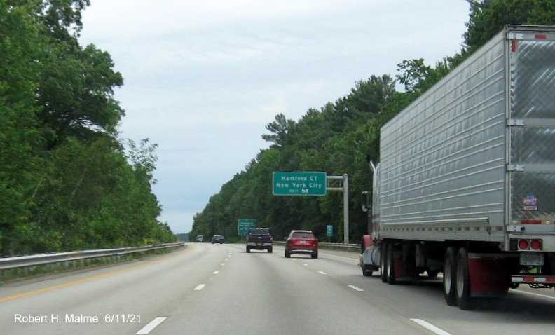 Image of overhead auxiliary sign for I-90/Massachusetts Turnpike exit with new milepost based exit number on I-495 North in Hopkinton, June 2021