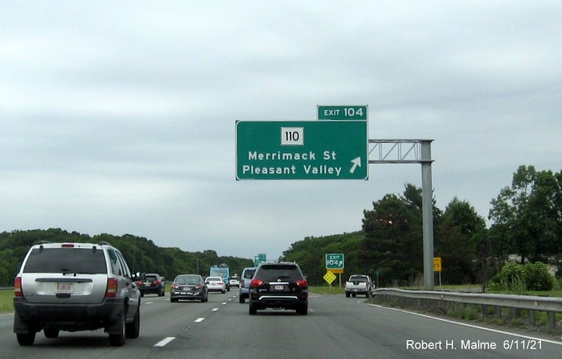 Image of overhead ramp sign for MA 110 exit with new milepost based exit number on I-495 North in Lawrence, June 2021